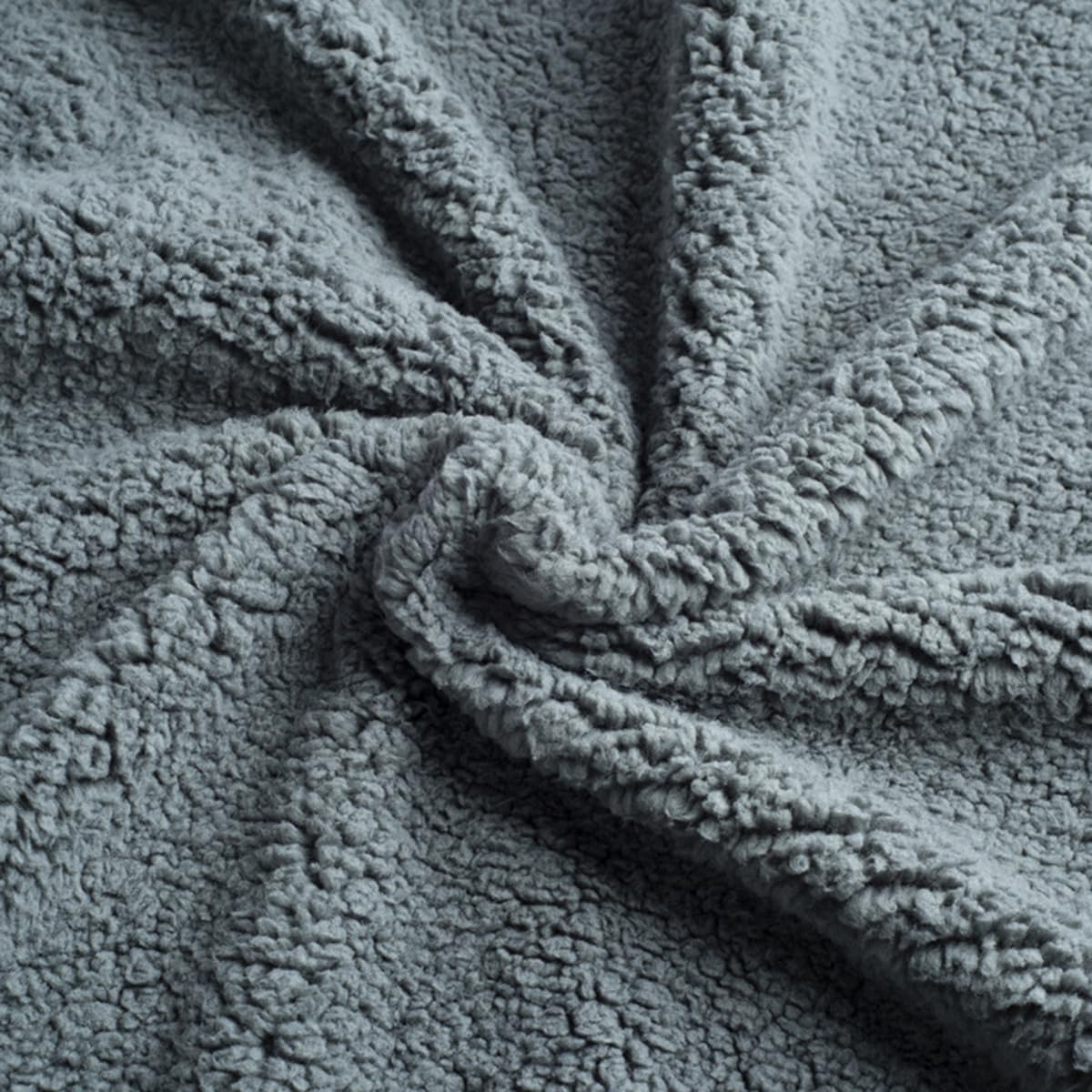 Close-up of a textured gray fabric with a soft, plush surface.
