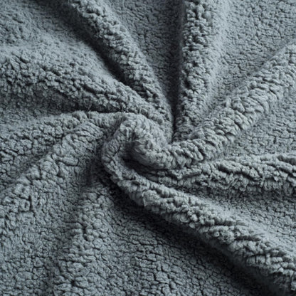 Close-up of a textured gray fabric with a soft, plush surface.