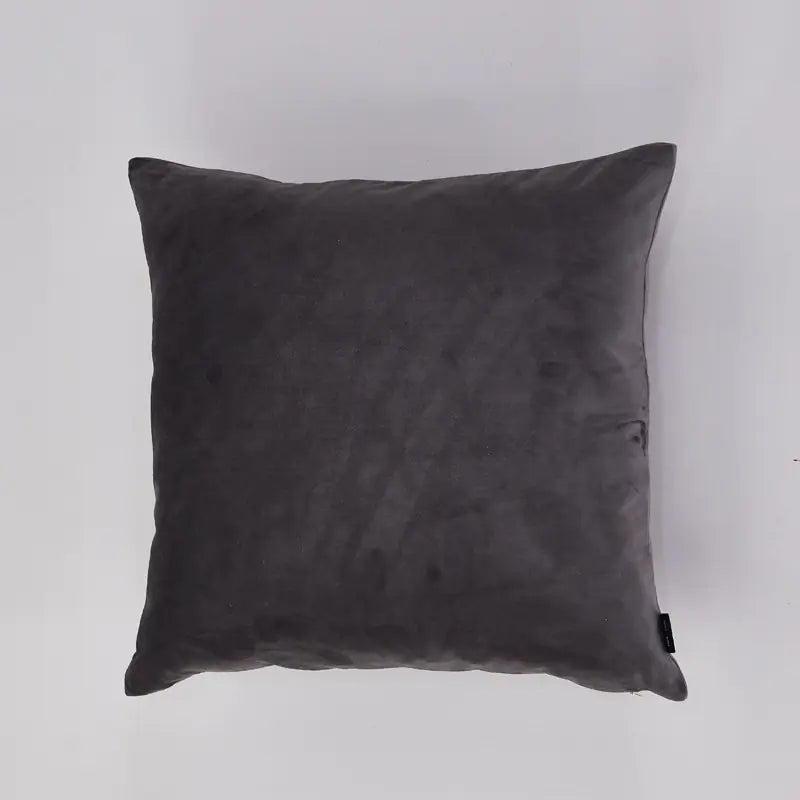 A square dark gray velvet throw pillow shown against a plain light gray background.