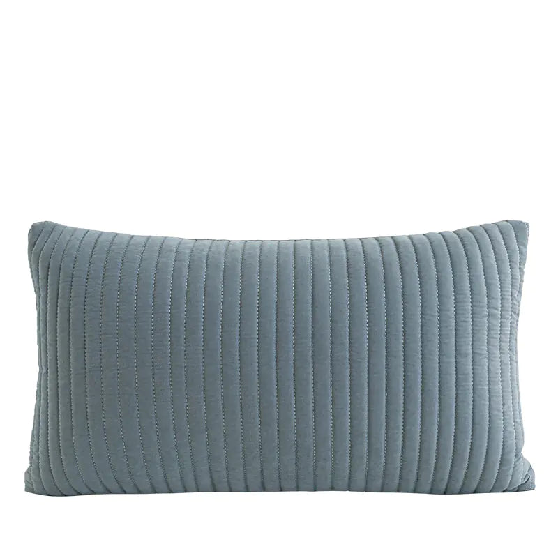 A rectangular lumbar pillow in a dusty blue-gray color with vertical channel tufting, shown against a plain white background.